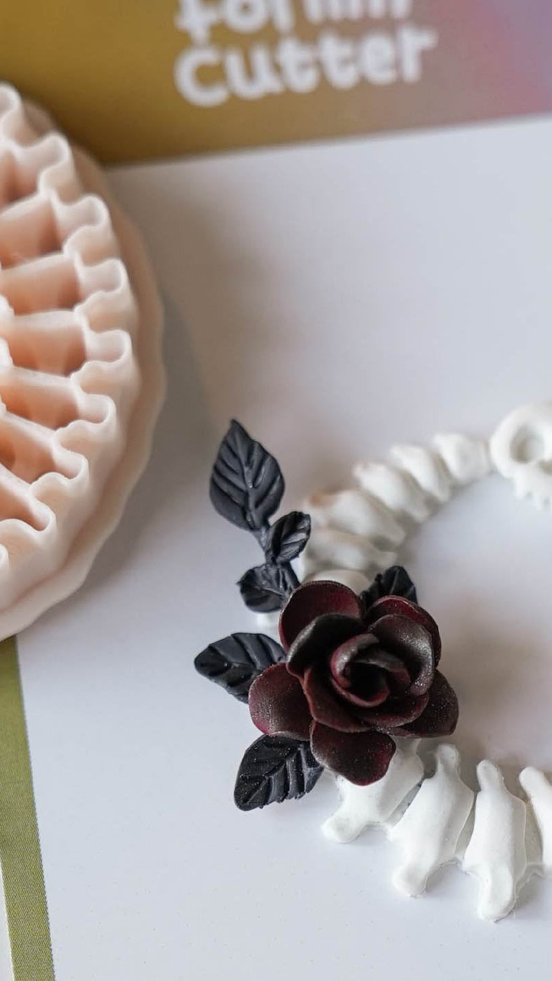 Crescent moon spine polymer clay cutter with finished gothic clay jewelry
