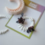 Gothic crescent spine clay jewelry decorated with dark red roses