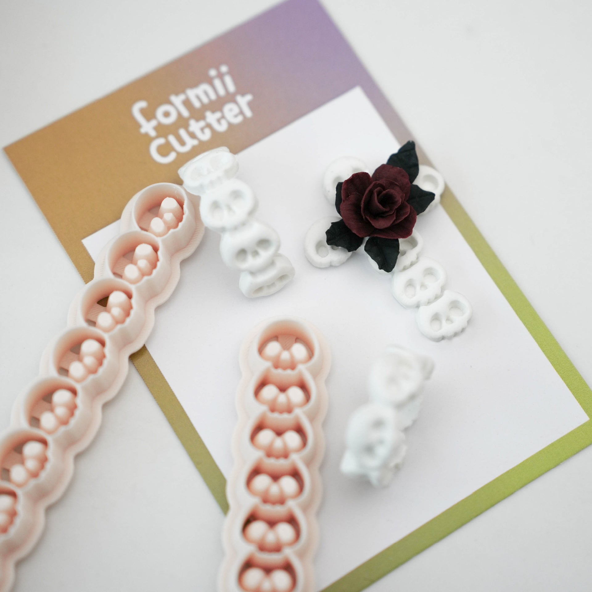 Skull border clay cutters with finished bone white skull jewelry