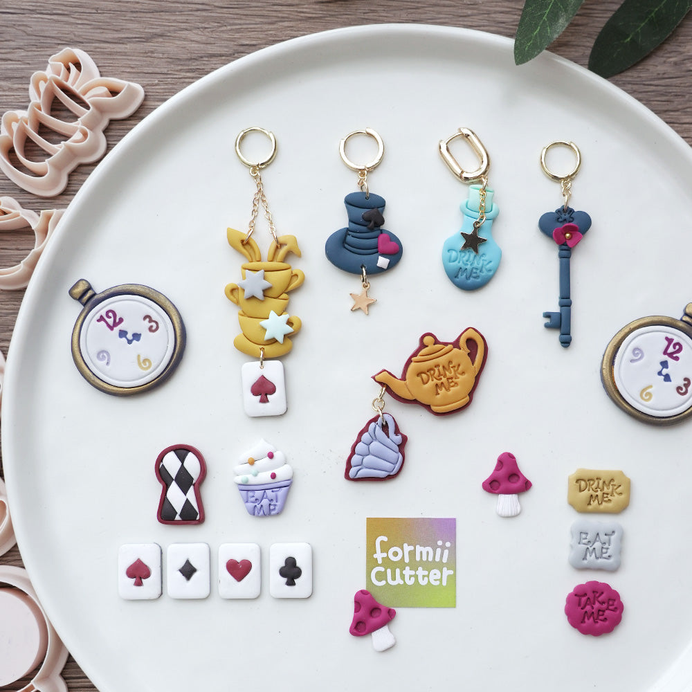 Wonderland themed polymer clay examples and tools