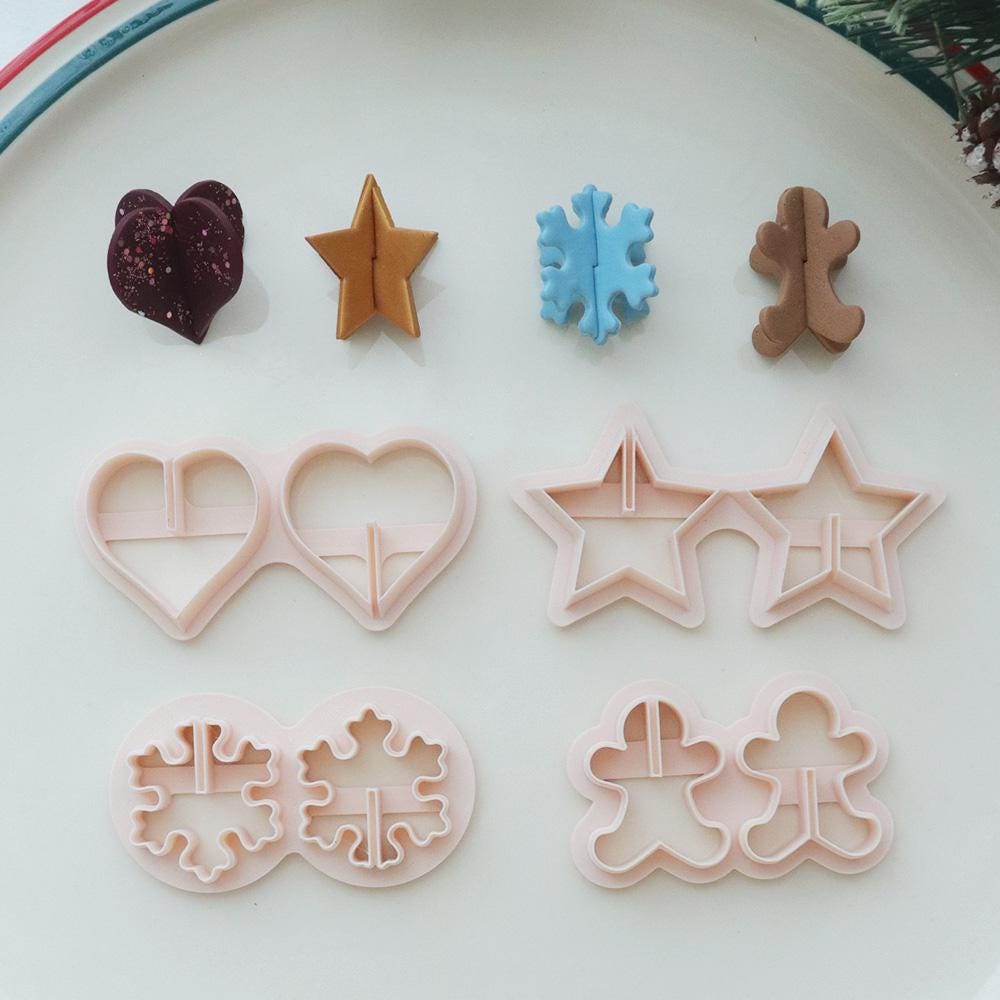 Holiday origami polymer clay cutter set with heart star snowflake and gingerbread shapes