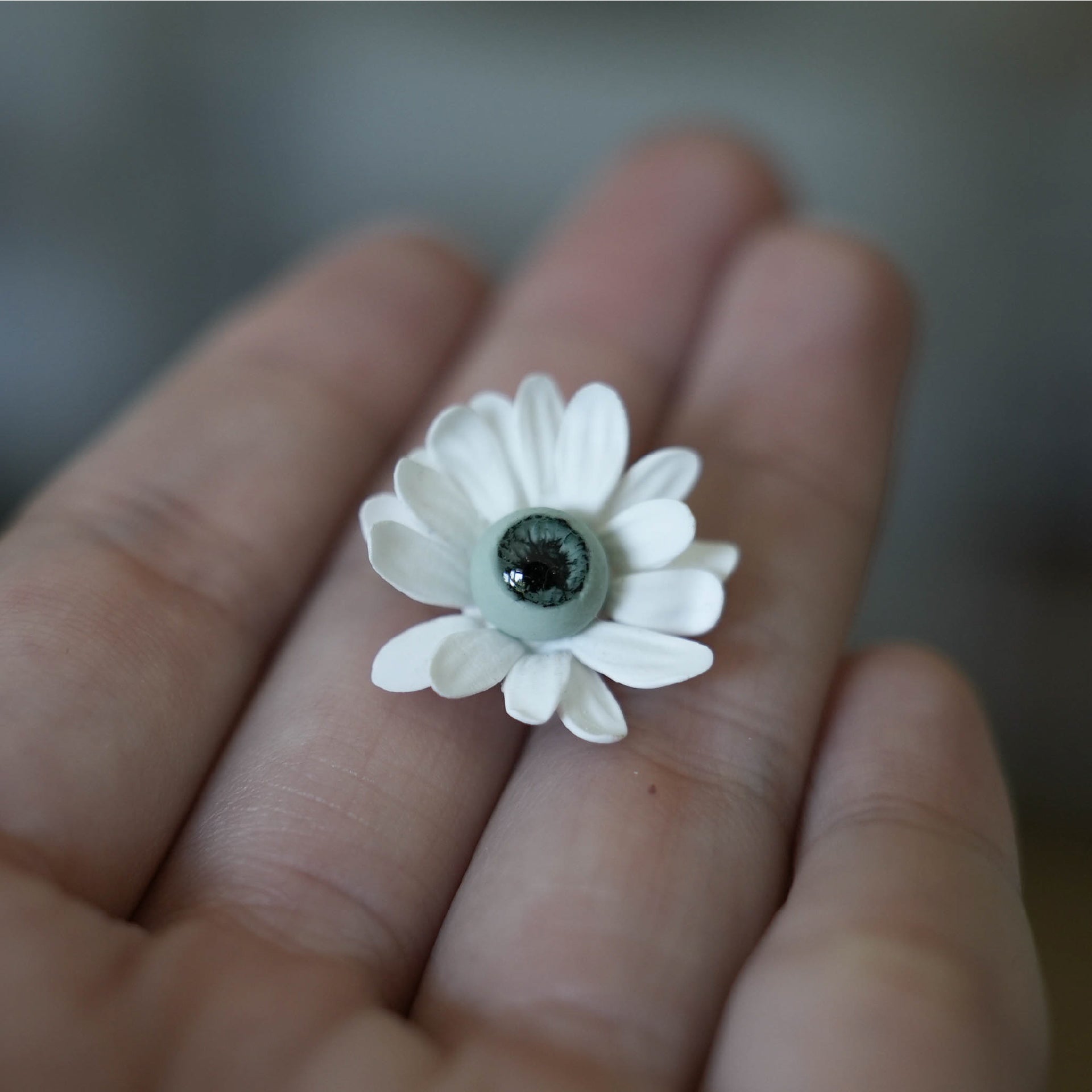 Finished polymer clay flower made with a raised center