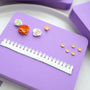 Purple flower shaping pad with demonstration props