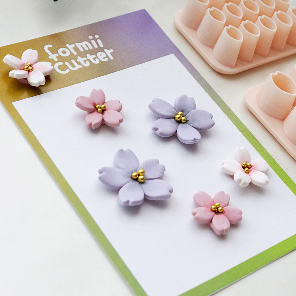Close-up of layered cherry blossom clay flower examples